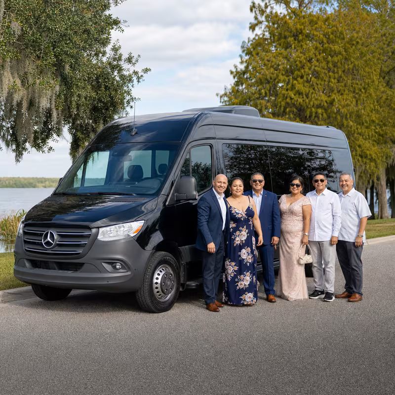 Group beside a Mercedes Sprinter limo from the Orlando fleet