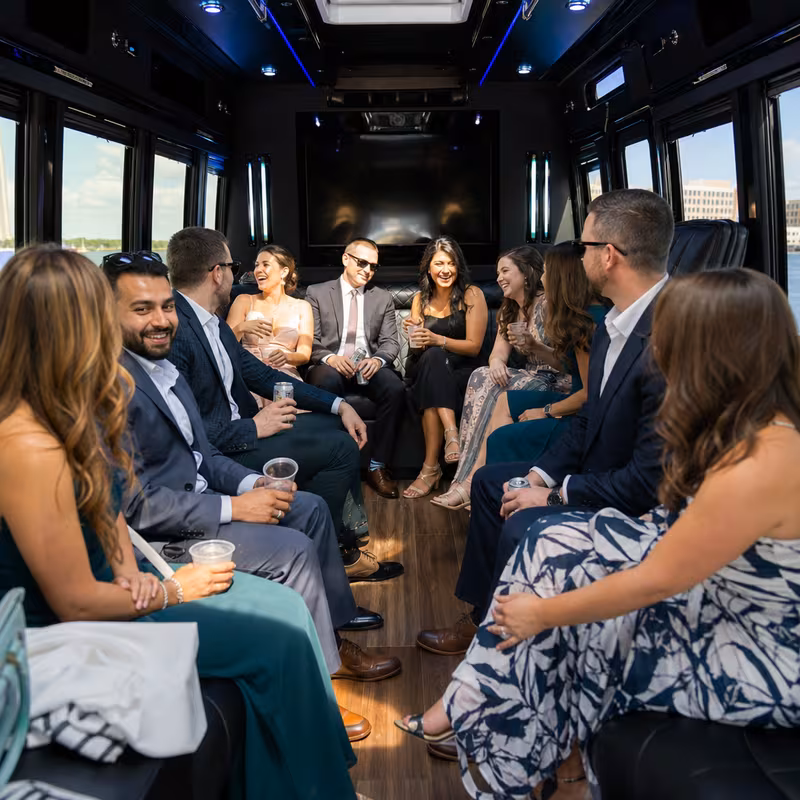 Wedding guests seated inside a Orlando party bus