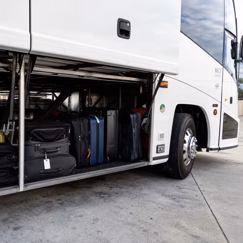Party bus interior with wraparound leather seating and LED lighting in Orlando