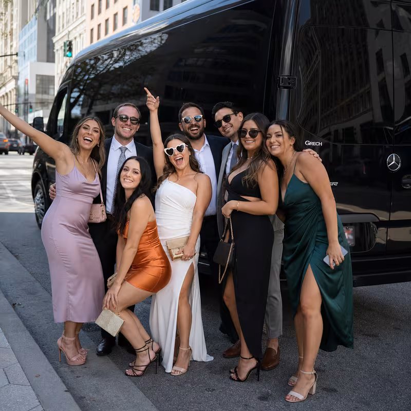 Group boarding a white charter bus for Bachelor & Bachelorette Transportation transportation in Orlando