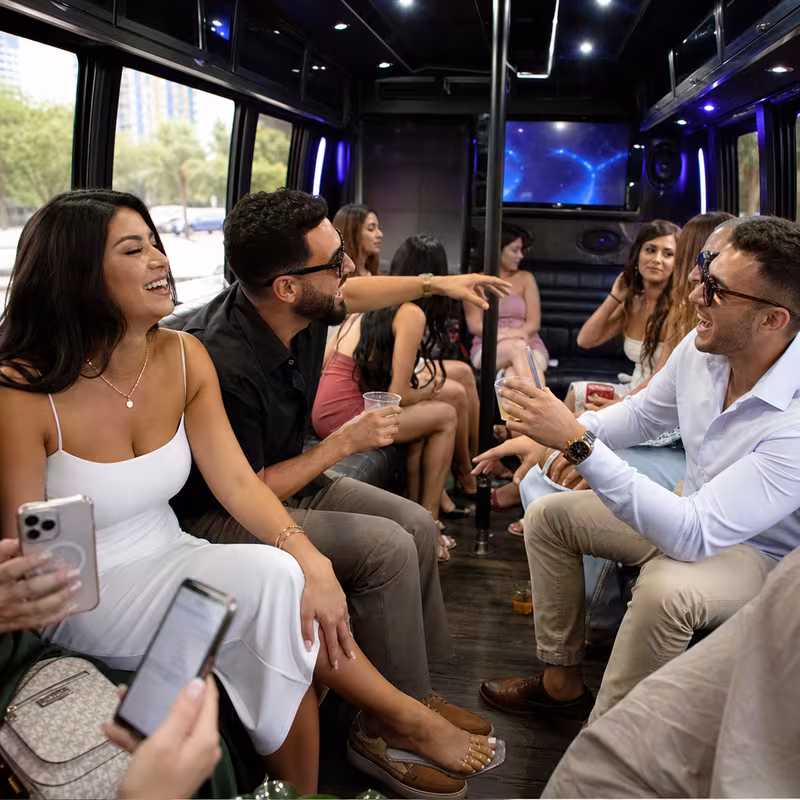 Party bus interior with wraparound leather seating and LED lighting in Orlando
