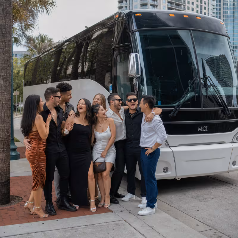 Passengers loading luggage while boarding an Orlando group shuttle