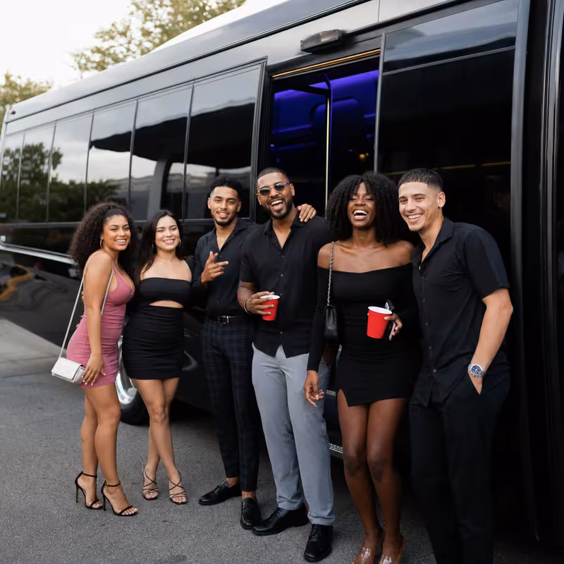 Party bus interior with wraparound leather seating and LED lighting in Orlando