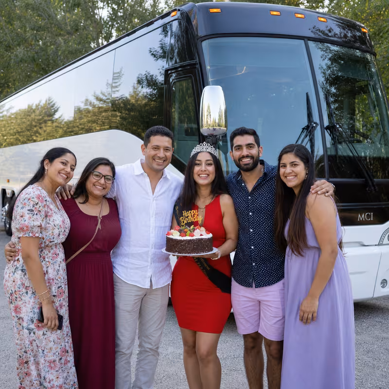Passengers loading luggage while boarding an Orlando group shuttle