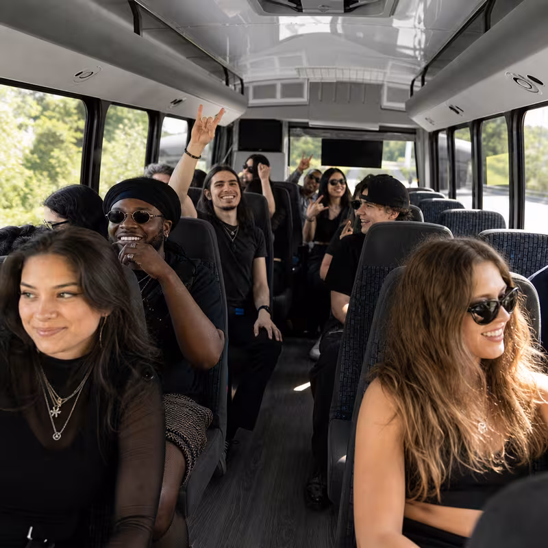 Party bus interior with wraparound leather seating and LED lighting in Orlando