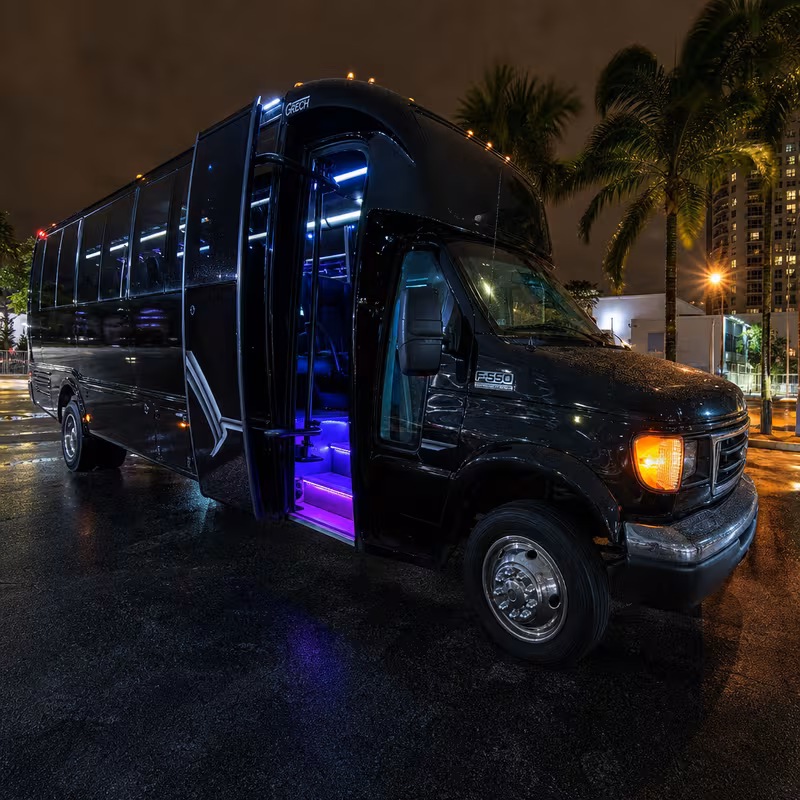 Party bus interior with wraparound leather seating and LED lighting in Orlando