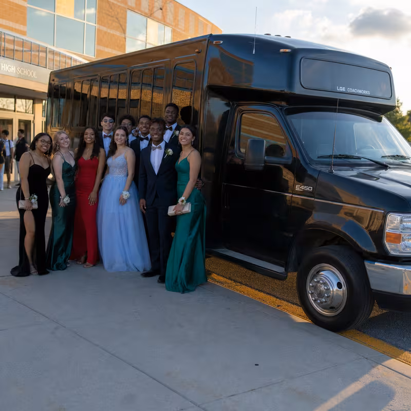 Group boarding a white charter bus for Prom & Homecoming Transportation transportation in Orlando