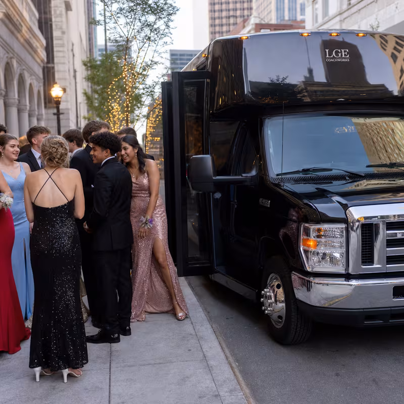 Passengers loading luggage while boarding an Orlando group shuttle