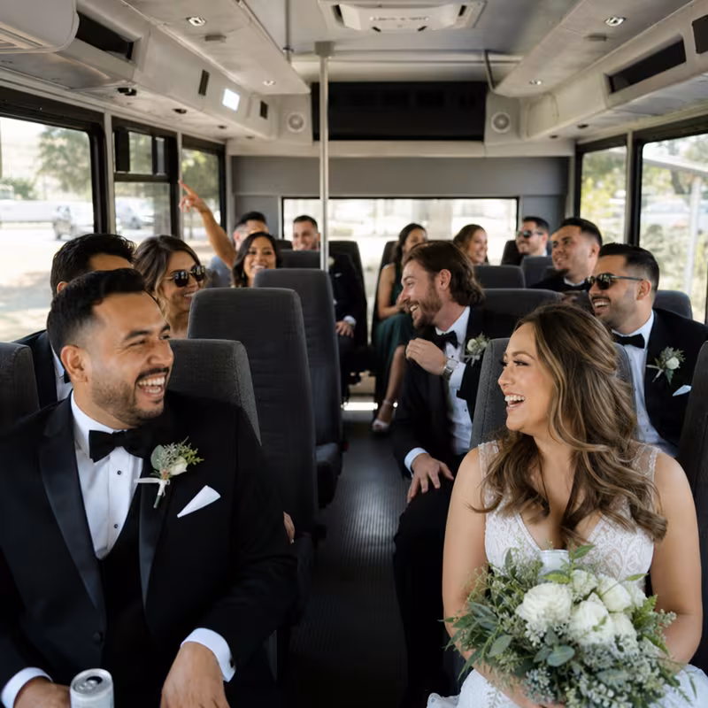 Group boarding a white charter bus for Wedding Transportation transportation in Orlando