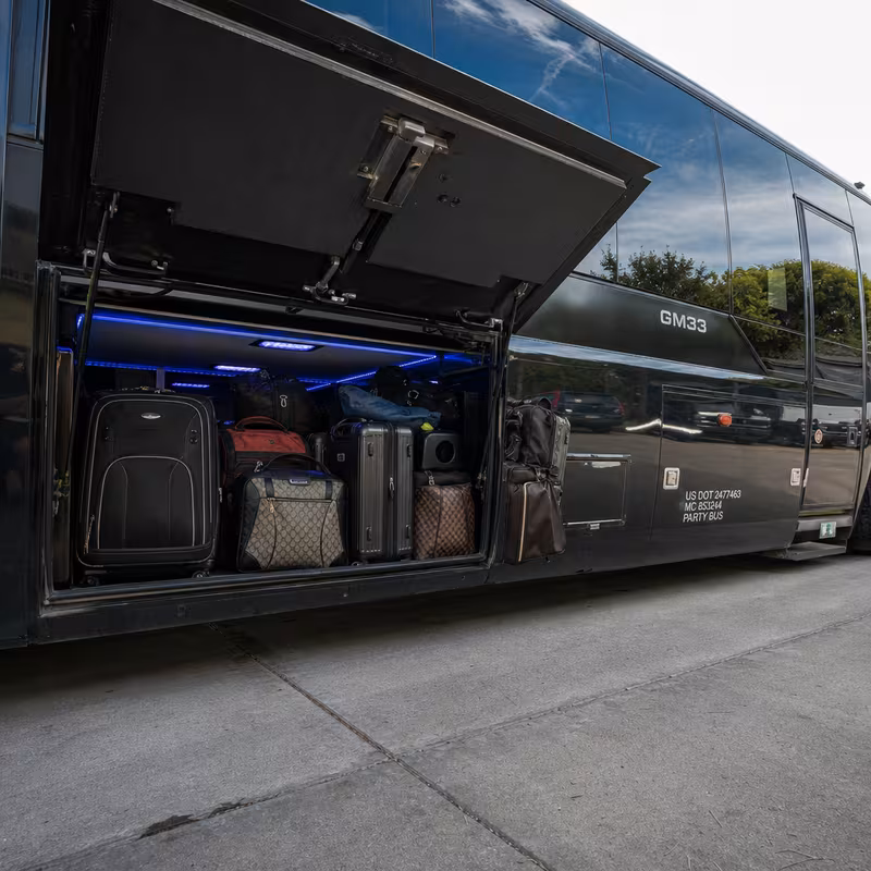 Party bus interior with wraparound leather seating and LED lighting in Orlando