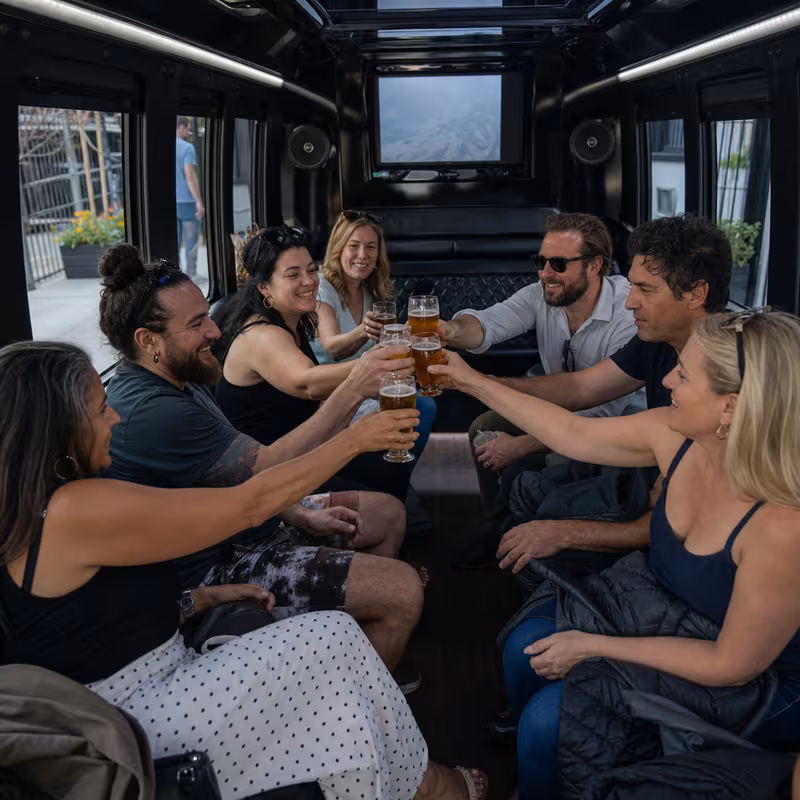 Group boarding a white charter bus for Winery & Brewery Tour Transportation transportation in Orlando